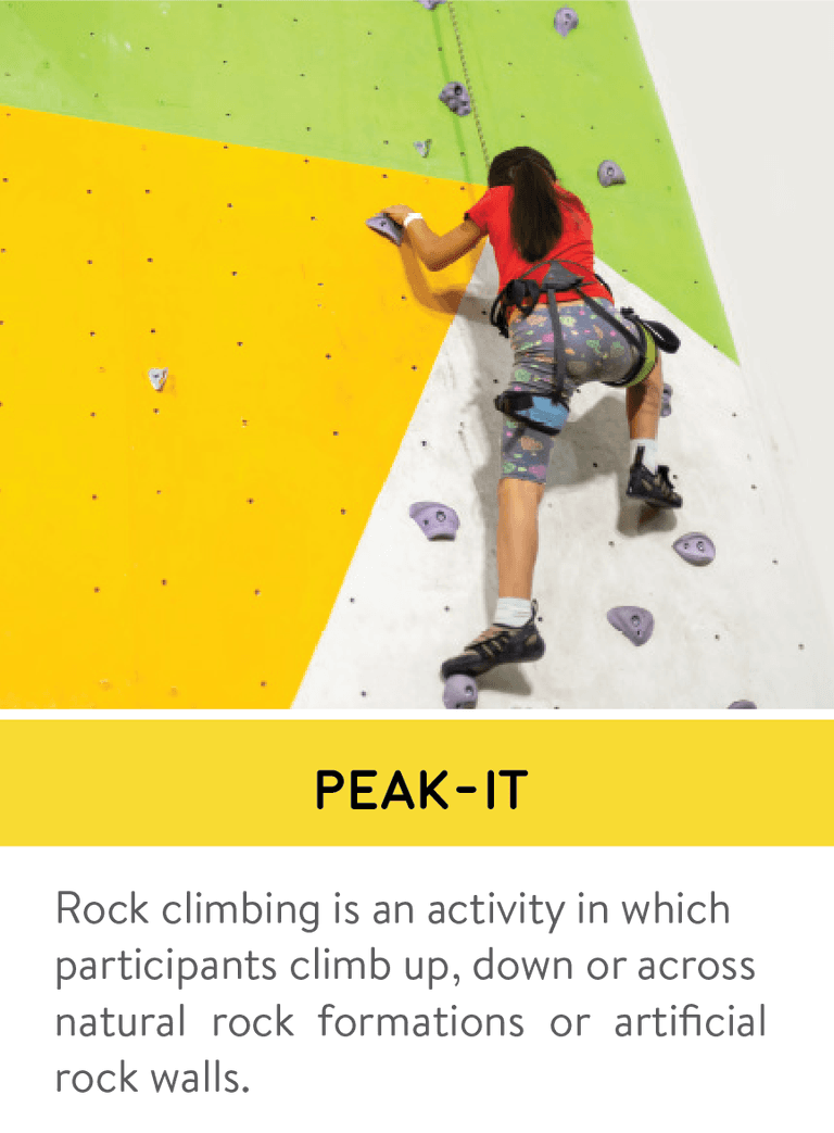 Visitor climbing an indoor rock wall at Next Gen Theme Park